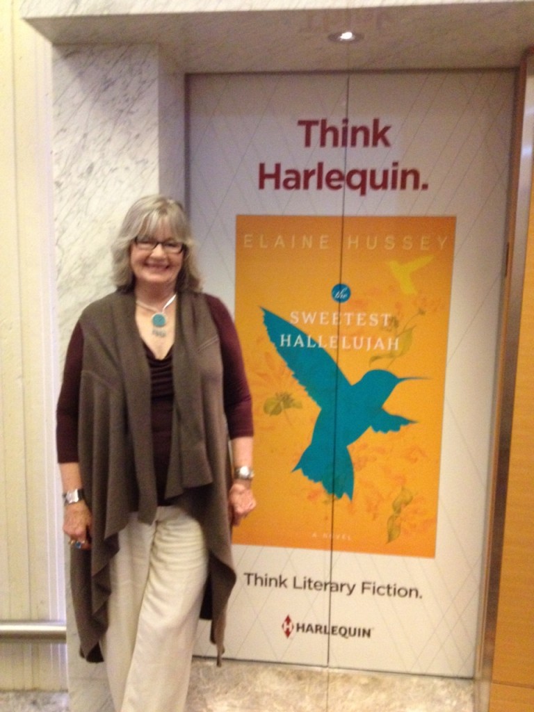 Author Elaine Hussey poses with her cover at RWA in Atlanta.
