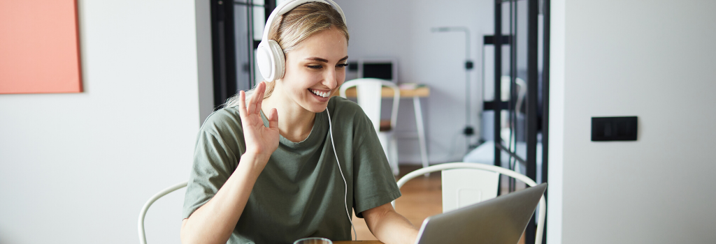 woman on a video chat waving