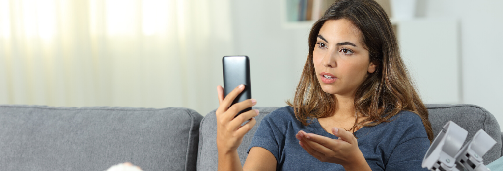 Woman on couch video chatting over phone