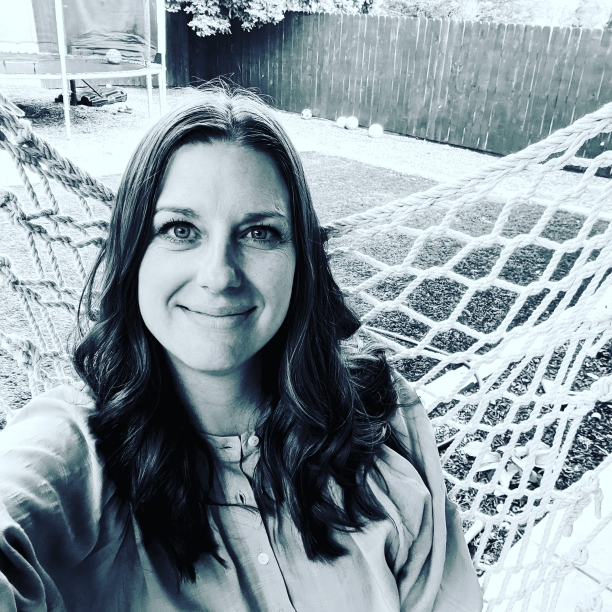 A black and white selfie of author Jill Lynn