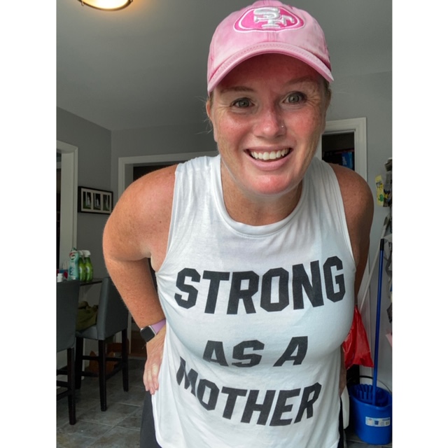Cari Gangaram in a pink hat. Her shirt says Strong As A Mother.