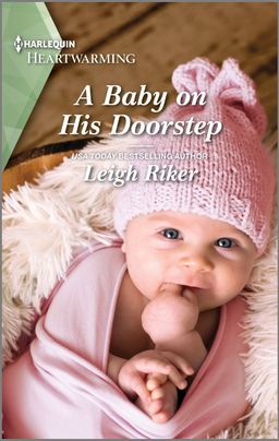 Cover image for A Baby on His Doorstep by Leigh Riker, featuring an overhead image of a baby wrapped in a pink blanket and in a knitted pink hat.