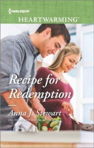 Cover image for Recipe for Redemption by Anna J. Stewart, featuring a man and a woman in a kitchen. The woman is stirring something in a pot. The man is standing by a bowl of vegetables. 
