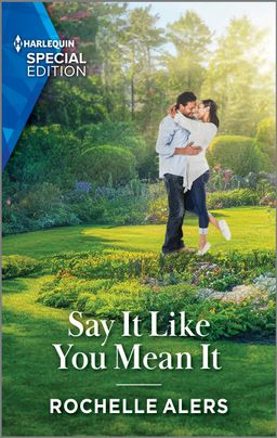 Cover image for Say It Like You Mean It by Rochelle Alers, featuring a man and a woman in a large green field. They are hugging. There are large trees and flowers in the background. 