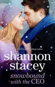 Cover image for Snowbound with the CEO by Shannon Stacey, featuring a woman and a man staring into each other's eyes. The man is wearing a scarf that the woman is holding on to. There are snowflakes surrounding them.
