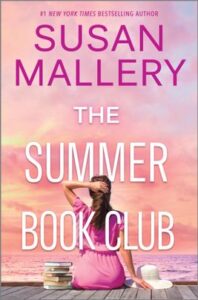 Cover image for The Summer Book Club by Susan Mallery, featuring a woman sitting on a dock, facing away from the viewer and looking off into the sunset. She has a stack of books on her left, and a sunhat sitting on her right. Her left hand is resting on her hair. 