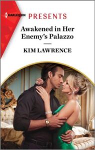 Cover image for Awakened in Her Enemy's Palazzo by Kim Lawrence, featuring a man and a woman embracing in a bedroom. The man is in a dark shirt and pants, the woman is in a green dress. Behind them is an expensive looking room with gold decor and a large bed.