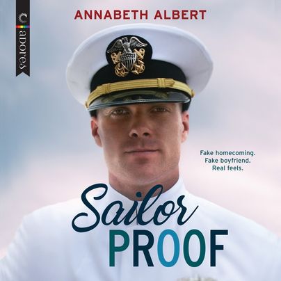 Audiobook cover for Sailor Proof by Annabeth Albert, featuring a man in a sailor's uniform and hat. He is looking right into the camera, with a blue sky in the background.