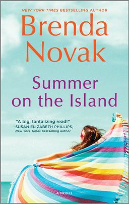 Cover image for Summer on the Island by Brenda Novak, featuring a woman wrapping a rainbow towel around her shoulders while looking out at the ocean.