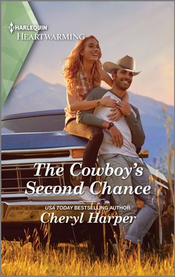 Cover of 'THE COWBOY'S SECOND CHANCE' by Cheryl Harper featuring a rugged cowboy in a Stetson hat, leaning against a pick up truck with a picturesque ranch backdrop. There is a woman sitting on the truck behind him with her arms wrapped around him. The book title and author's name are prominently displayed below the image