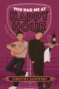 Cover image for YOU HAD ME AT HAPPY HOUR by Timothy Janovsky, featuring an illustration of two men on either sides of a large wine glass. The man on the left is holding a cocktail mixer, while the man on the right has a tray with a glass of wine and the bottle on top.