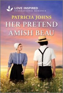 Cover image for HER PRETEND AMISH BEAU by Patricia Johns, featuring a man and a woman in amish dress in a field of flowers. The woman is facing the audience, while the man is facing away. They are looking at each other.