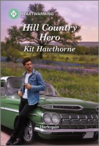 Cover image for HILL COUNTRY HERO by Kit Hawthorne, featuring a man in a denim jacket leaning against a green vintage car. There is a tree and a field of grass directly behind the car. 