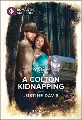 Cover image for A COLTON KIDNAPPING by Justine Davis, featuring a man and a woman in the woods. The man is wearing a cowboy hat. There is an RV trailer behind them.
