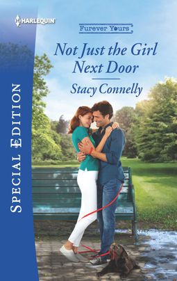 Cover image for Not Just the Girl Next Door by Stacy Connelly, featuring a man and a woman hugging outside by a park bench. There is a dog leash wrapped around their legs, attached to a playful dog to their right.