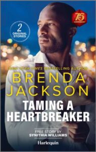 Cover image for TAMING A HEARTBREAKER by Brenda Jackson, featuring a man unbuttoning the cuff of his shirt. He is outdoors at night and we can see the lights of the city behind him.