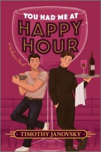 Cover image for YOU HAD ME AT HAPPY HOUR by Timothy Janovsky, featuring an illustration of two men on either sides of a large wine glass. The man on the left is holding a cocktail mixer, while the man on the right has a tray with a glass of wine and the bottle on top.