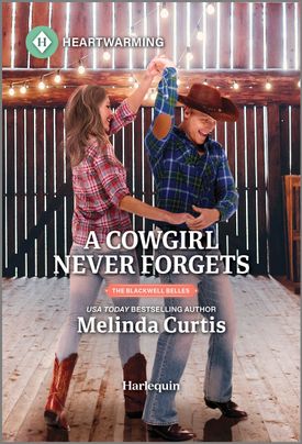 Cover image for A Cowgirl Never Forgets by Melinda Curtis, featuring a man and a woman dancing inside a barn. The woman is twirling the man, who is wearing a cowboy hat.