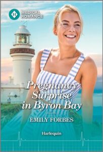 Cover image for Pregnancy Surprise in Byron Bay by Emily Forbes, featuring a woman sitting outside on a coastline. There is a lighthouse in the background. 