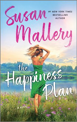 Cover image for The Happiness Plan by Susan Mallery, featuring a woman walking through a field towards a lake while putting her hair up in a ponytail. There is a breeze moving her hair and dress.
