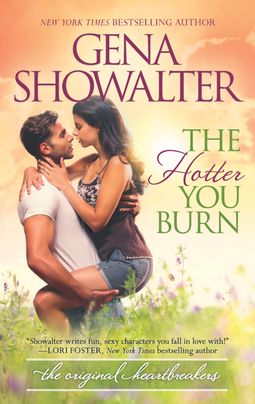 Cover image for The Hotter You Burn by Gena Showalter, featuring a man holding a woman in a field of flowers. The woman has her legs wrapped around the man's waist and her arms around his neck.