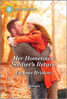 Cover image for HER HOMETOWN SOLDIER'S HOMETOWN RETURN by LeAnne Bristow, featuring a man and a woman embracing outdoors. They are surrounded by orange leaves on the ground.