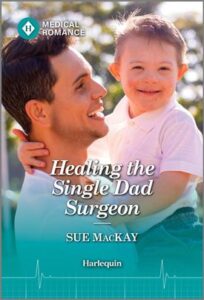 Cover image for HEALING THE SINGLE DAD SURGEON by Sue MacKay, featuring a man outside in the sunlight, holding a toddler in his arms.