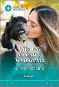 Cover image for CITY VET, COUNTRY TEMPTATION by Alison Roberts, featuring a woman holding a little black dog and kissing the dog on the head.